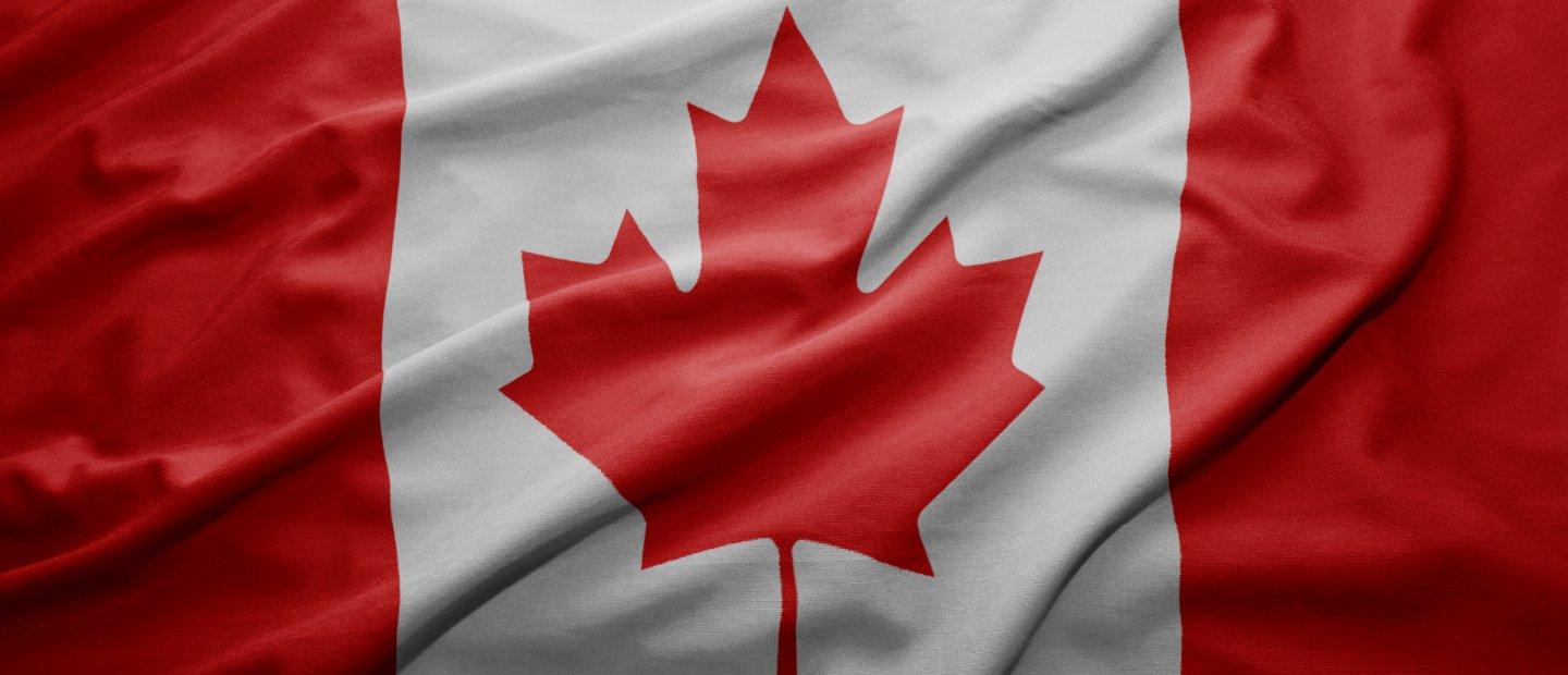 Canadian flag, red maple leaf centered on a white background with red section to the left and right