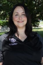 A professional headshot of Katrina Adrian in a black Oakland University shirt.